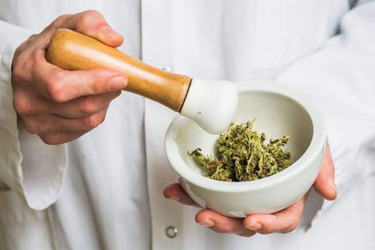 Marijuana in a mortar bowl being